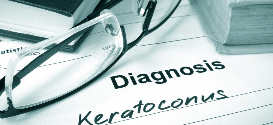 reading classes sitting on a doctors pad with a diagnosis of keratoconus