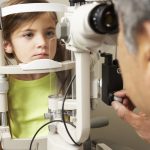 young girl having her eyes tested