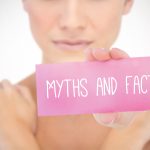 young female model holding up a sign saying myths and facts