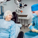 eye doctor discussing surgery with an elderly female patient