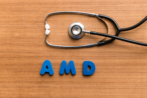 Macular Degeneration concept art of a stethascope on a table above the letters AMD