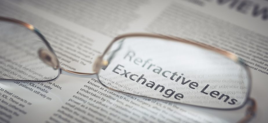 reading glasses resting on an open newspaper magnifying refractive lens exchange